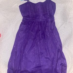 Purple sparkly dress.